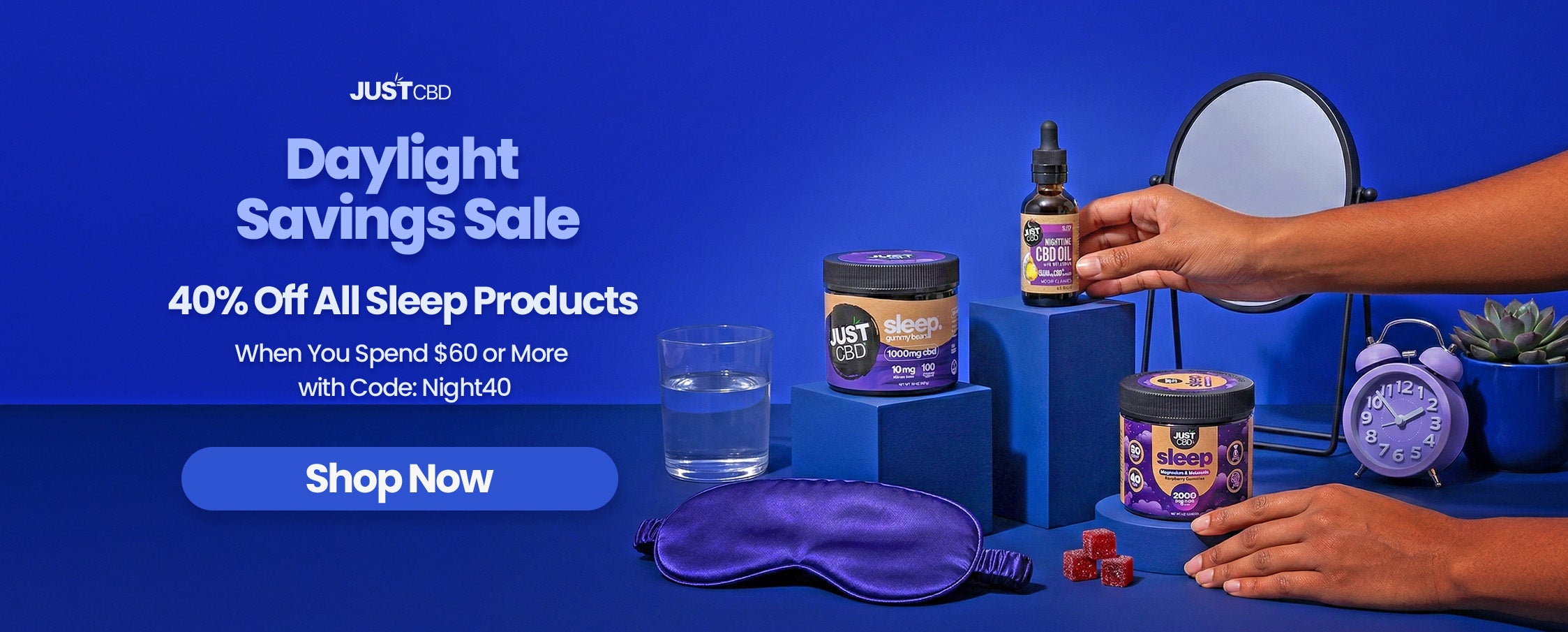 Sleep product set with a hand holding a bottle, promotional banner for Daylight Savings Sale on sleep products.