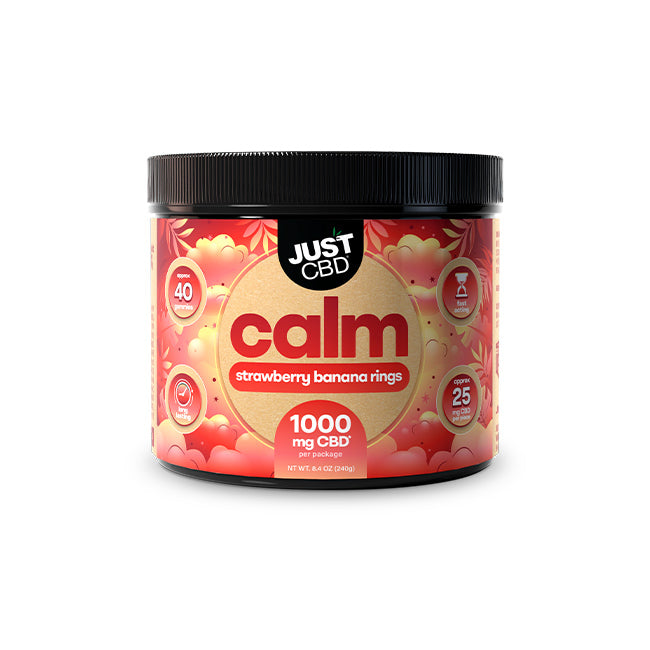A black plastic tub of Just CBD 'calm' strawberry banana rings CBD powder, 1000 mg CBD, on a solid white background.