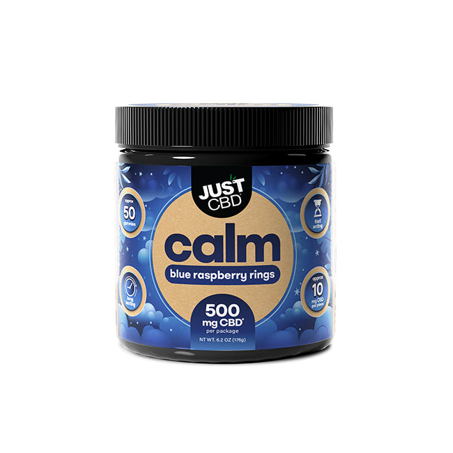 A jar of Just CBD 'calm' blue raspberry rings CBD butter package, 500 mg CBD, on a white background.